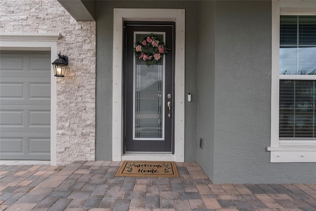 property entrance with a garage