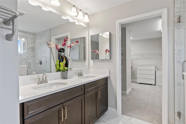 bathroom featuring an enclosed shower and vanity