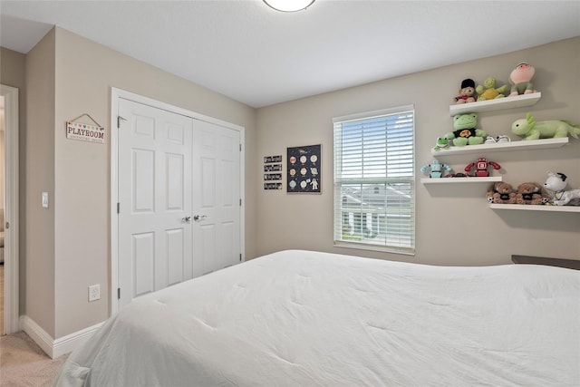 carpeted bedroom featuring a closet