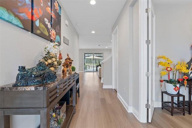 hallway featuring light hardwood / wood-style flooring