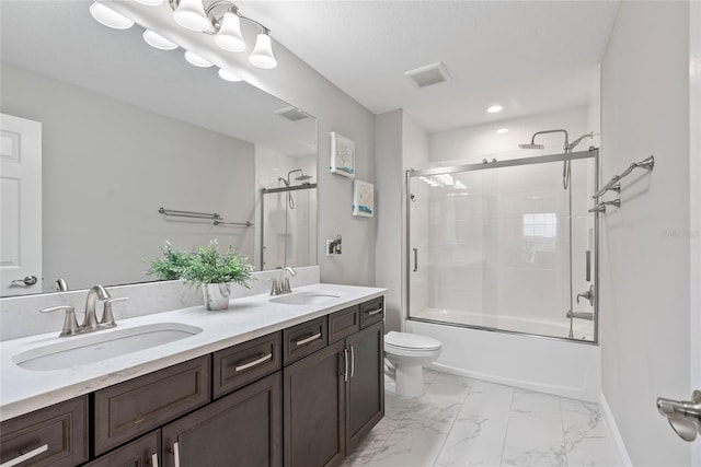 full bathroom featuring toilet, vanity, and combined bath / shower with glass door