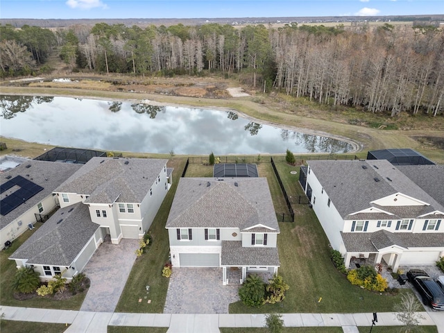 birds eye view of property with a water view