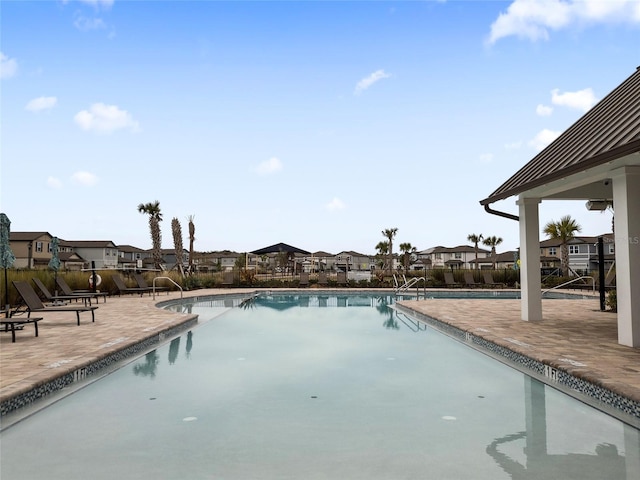 view of swimming pool with a patio area