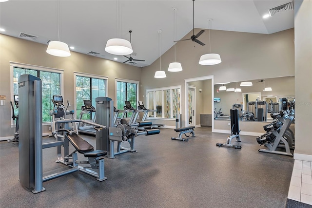 gym featuring ceiling fan and high vaulted ceiling