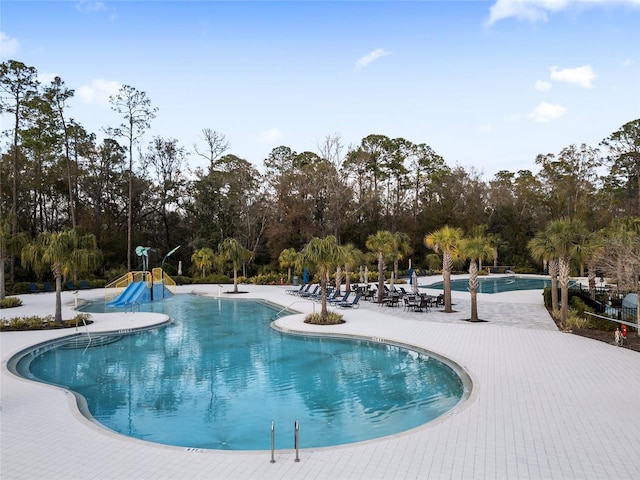 view of swimming pool featuring a patio