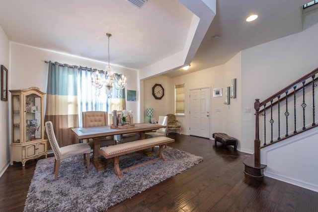 dining room featuring a chandelier and dark wood-type flooring