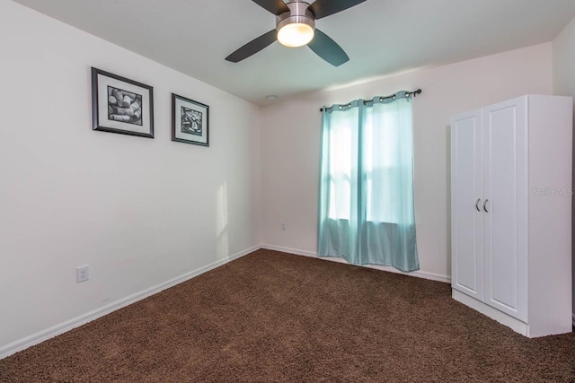 unfurnished room featuring carpet floors and ceiling fan