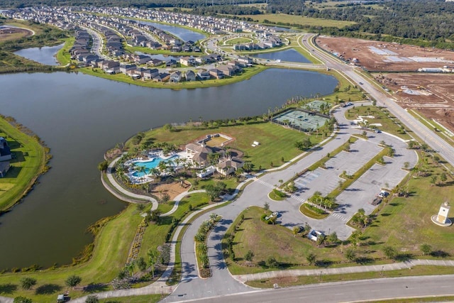 birds eye view of property with a water view