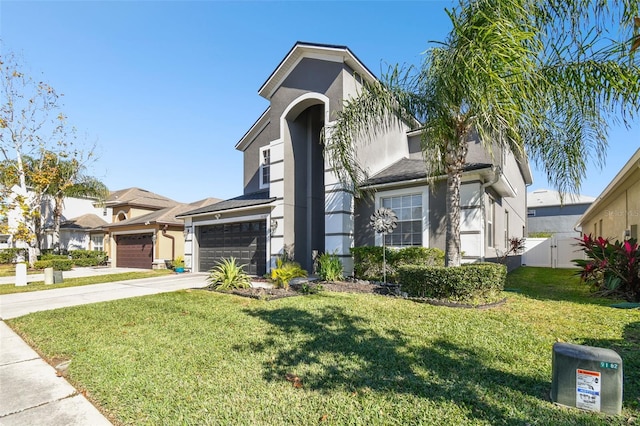 view of front of property featuring a garage and a front lawn