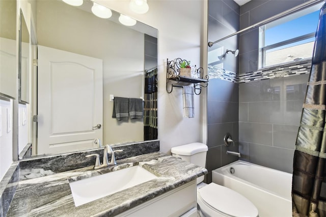 full bathroom featuring vanity, toilet, and shower / bath combo with shower curtain