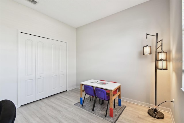 recreation room with light hardwood / wood-style flooring