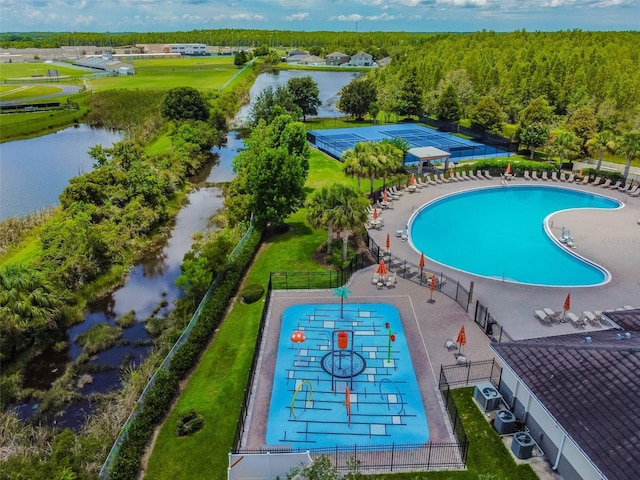 view of swimming pool with a water view