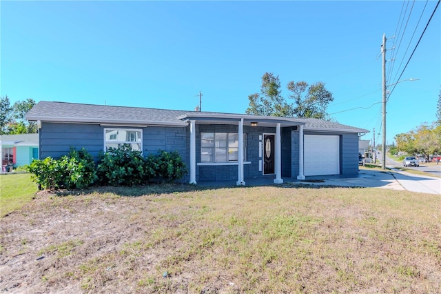 single story home with a front lawn and a garage