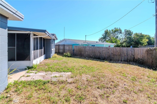 view of yard with a sunroom