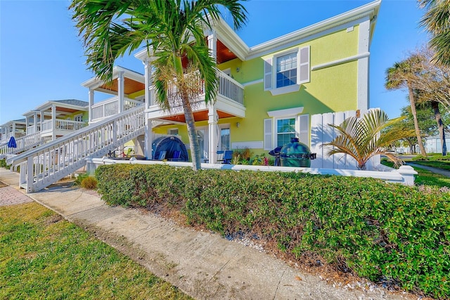 view of front of house featuring a balcony