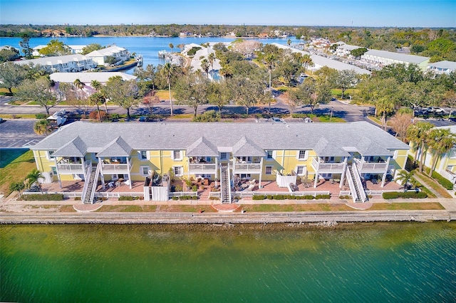 birds eye view of property with a water view