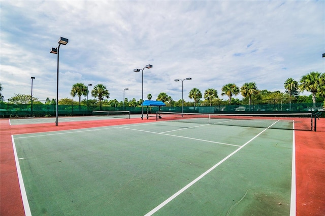 view of tennis court featuring basketball court