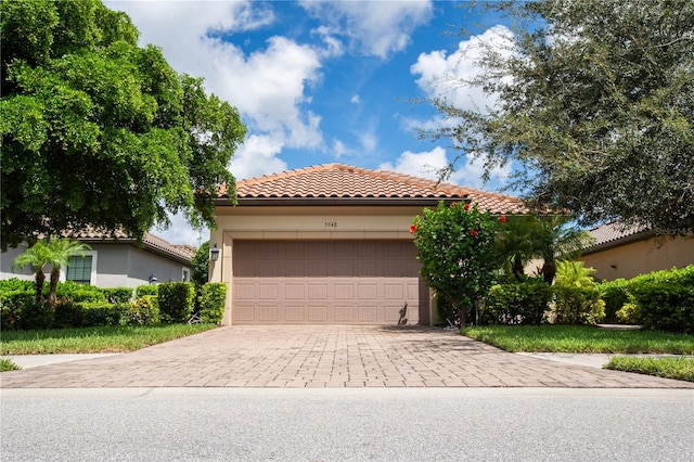 mediterranean / spanish-style home featuring a garage