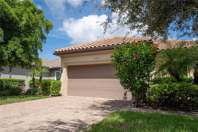 mediterranean / spanish-style home featuring a garage