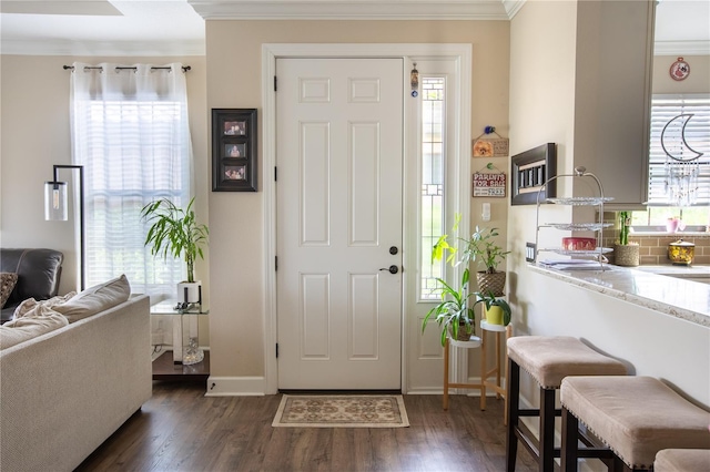 entryway featuring dark hardwood / wood-style flooring and crown molding