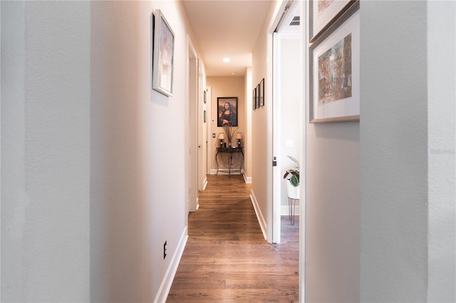 corridor featuring dark wood-type flooring