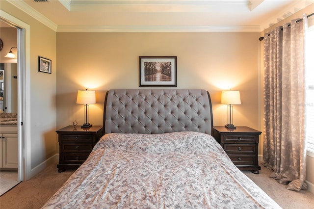 carpeted bedroom featuring crown molding and a raised ceiling