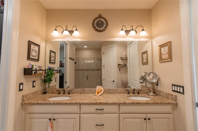 bathroom with walk in shower and vanity