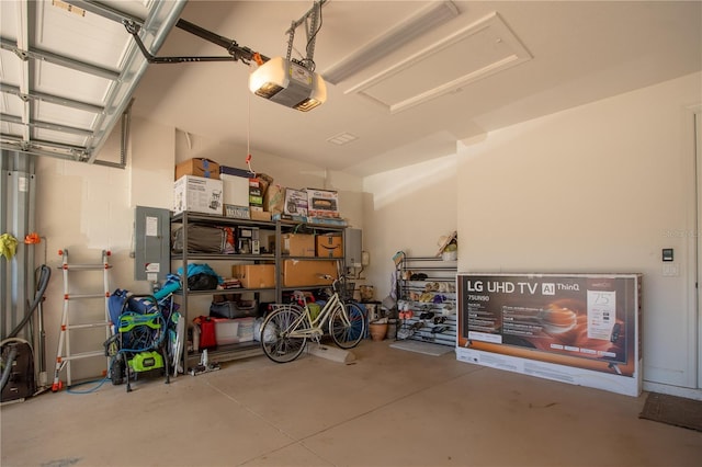 garage featuring a garage door opener and electric panel