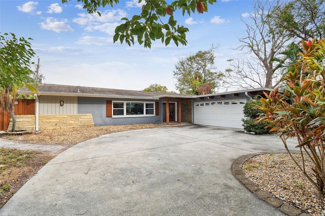 ranch-style house featuring a garage