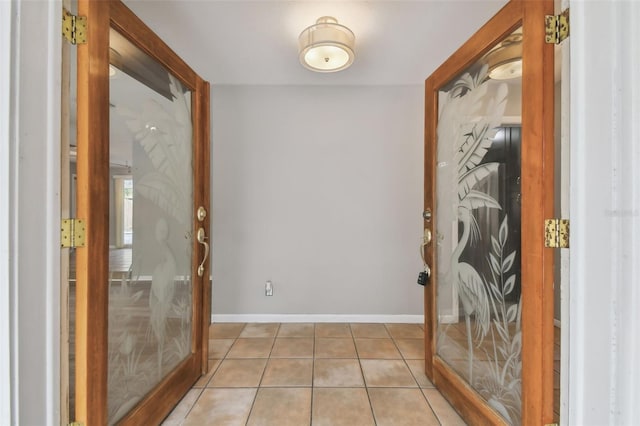 interior space with french doors and light tile patterned floors