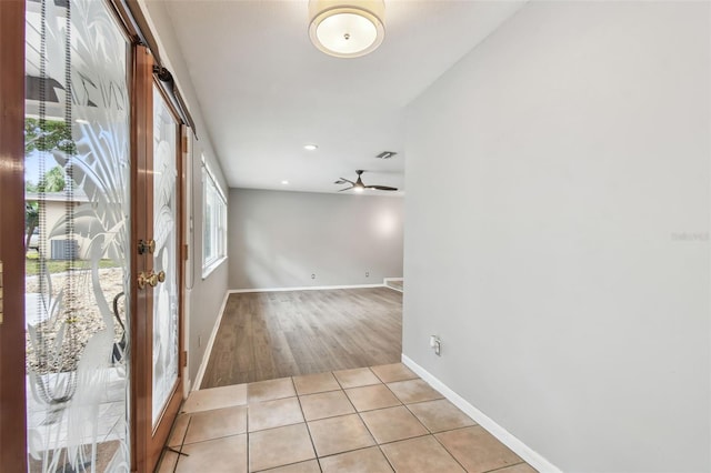 interior space featuring ceiling fan and french doors