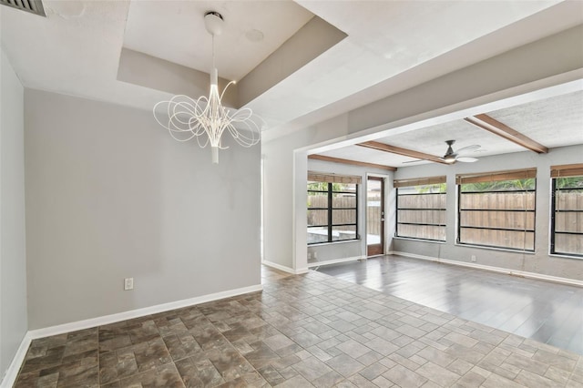 empty room with beamed ceiling, ceiling fan with notable chandelier, and hardwood / wood-style floors