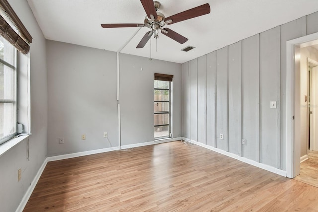 unfurnished room with light hardwood / wood-style floors and ceiling fan