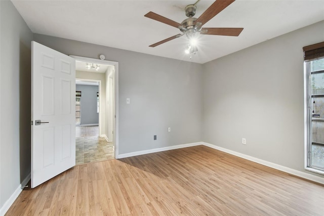 unfurnished room with ceiling fan and light hardwood / wood-style flooring