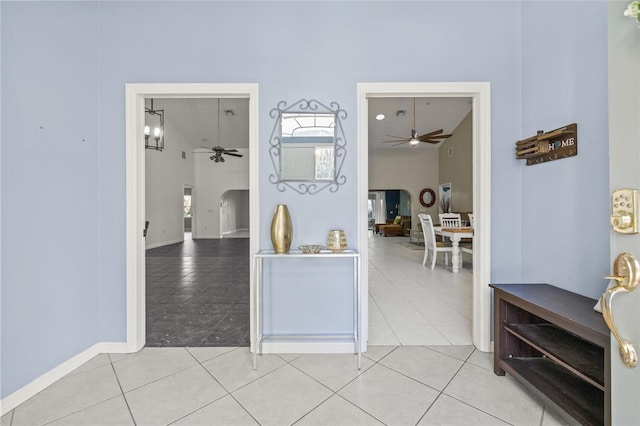 hall featuring light tile patterned flooring