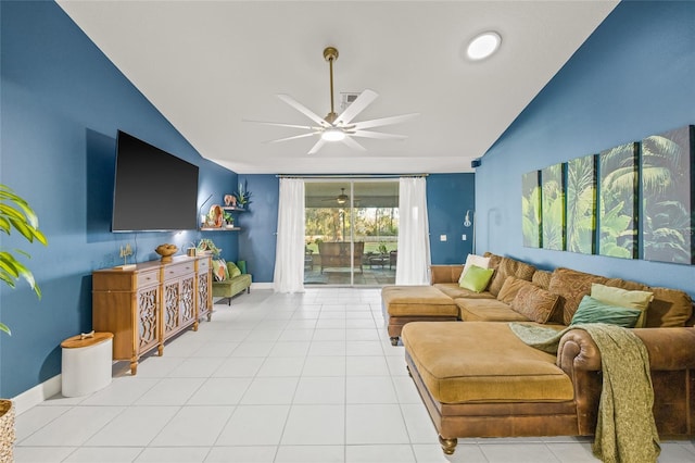 tiled living room featuring ceiling fan and vaulted ceiling