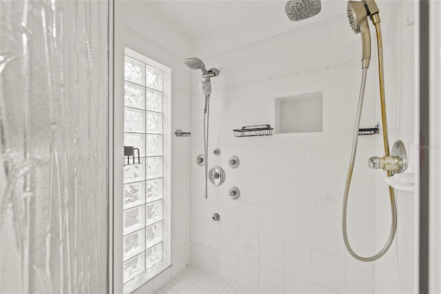 bathroom with a tile shower