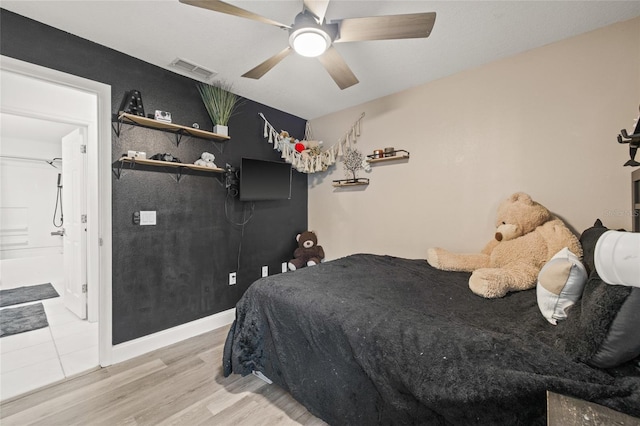 bedroom featuring ceiling fan and hardwood / wood-style floors