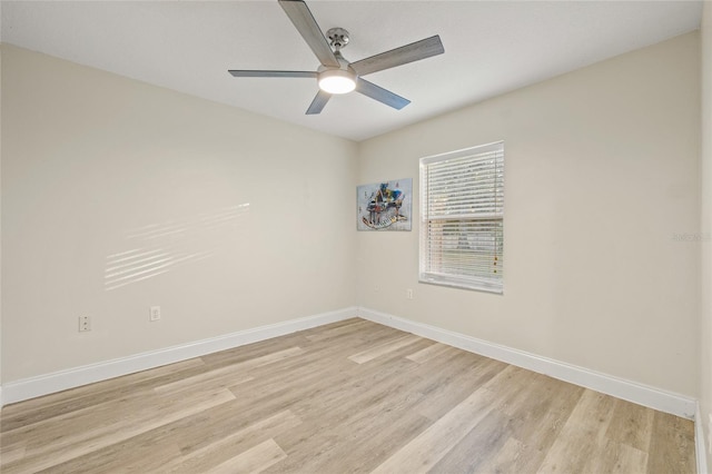 empty room with ceiling fan and light hardwood / wood-style floors