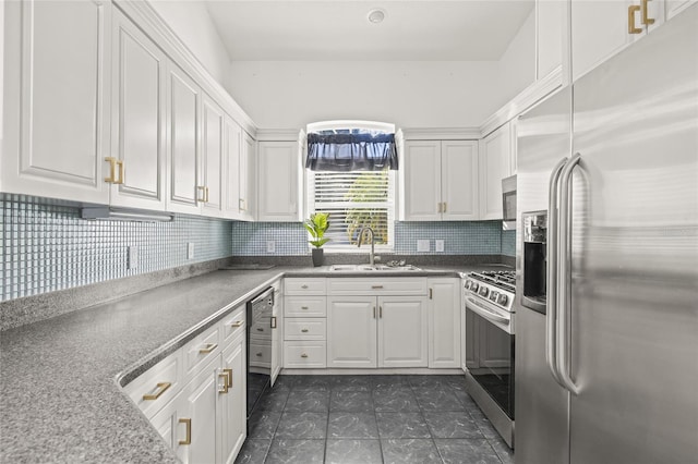 kitchen featuring sink, appliances with stainless steel finishes, and white cabinetry