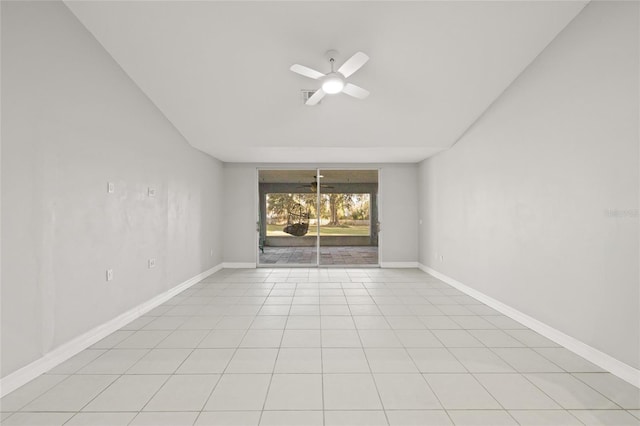 unfurnished room with ceiling fan and light tile patterned floors