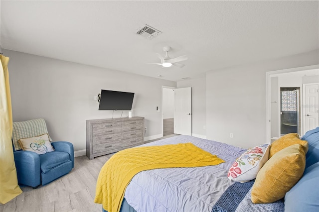 bedroom with ceiling fan and light hardwood / wood-style flooring