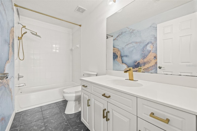 full bathroom featuring toilet, vanity, and tiled shower / bath combo