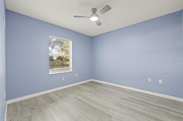 unfurnished room with light wood-type flooring and ceiling fan