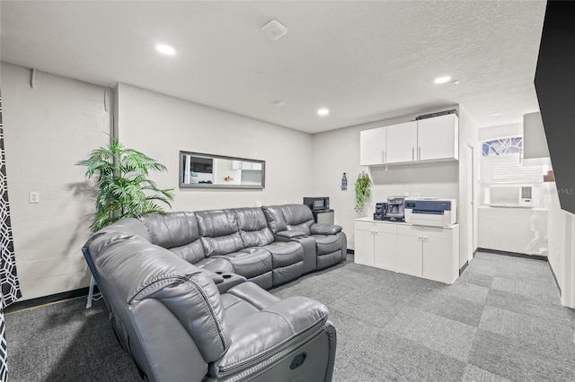 living room featuring a textured ceiling