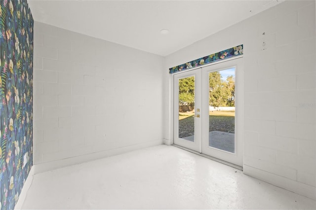 empty room featuring french doors