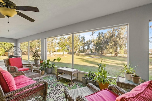 sunroom with ceiling fan