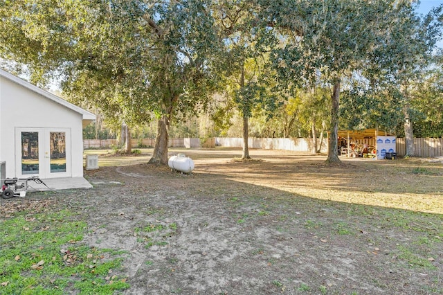 view of yard with french doors