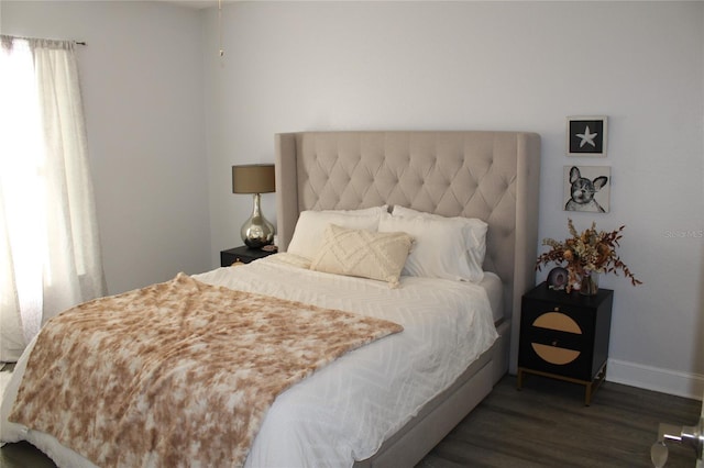 bedroom featuring dark wood-type flooring