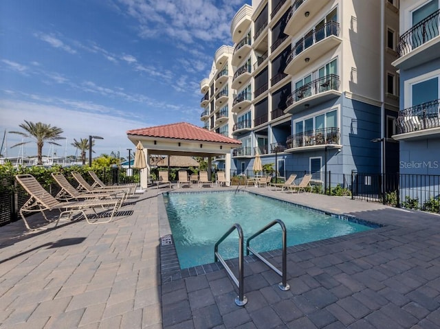 view of swimming pool featuring a gazebo and a patio area